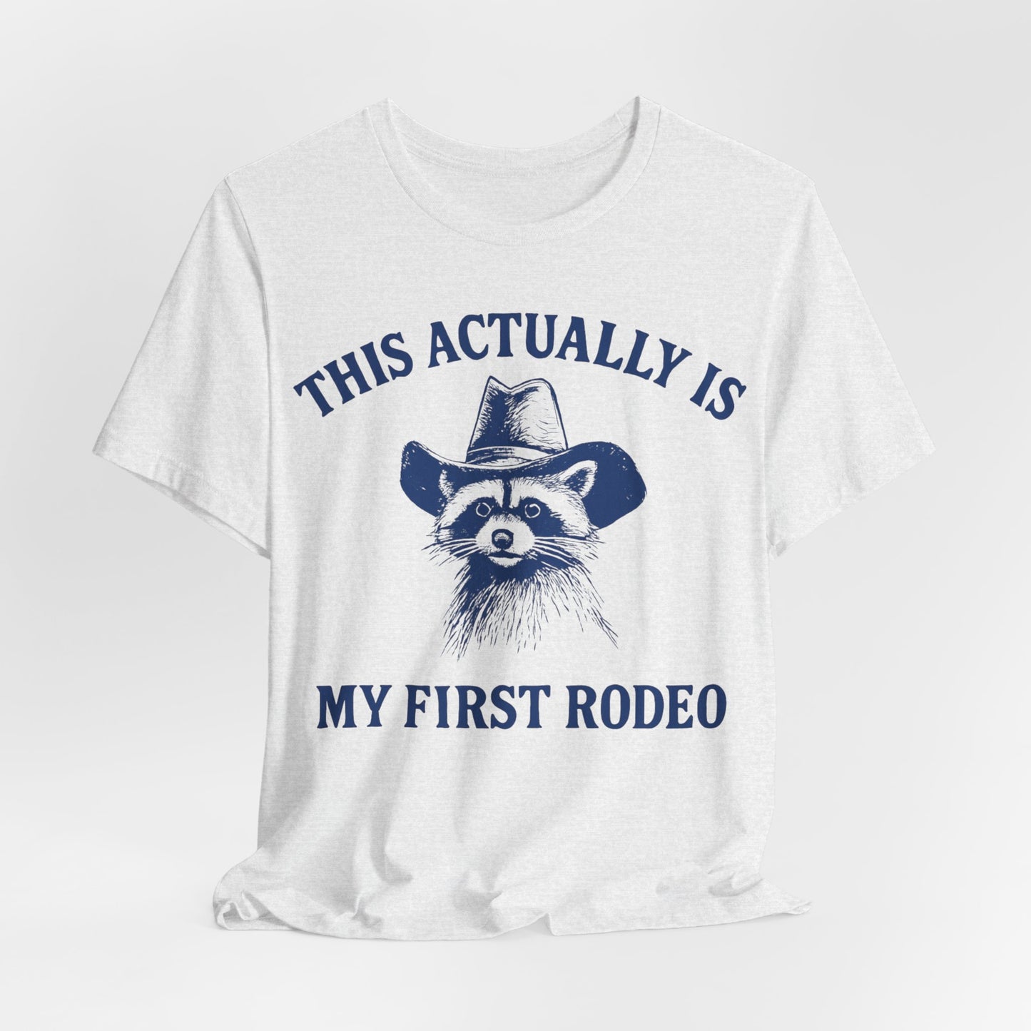 This Actually Is My First Rodeo – Cowboy Raccoon Tee