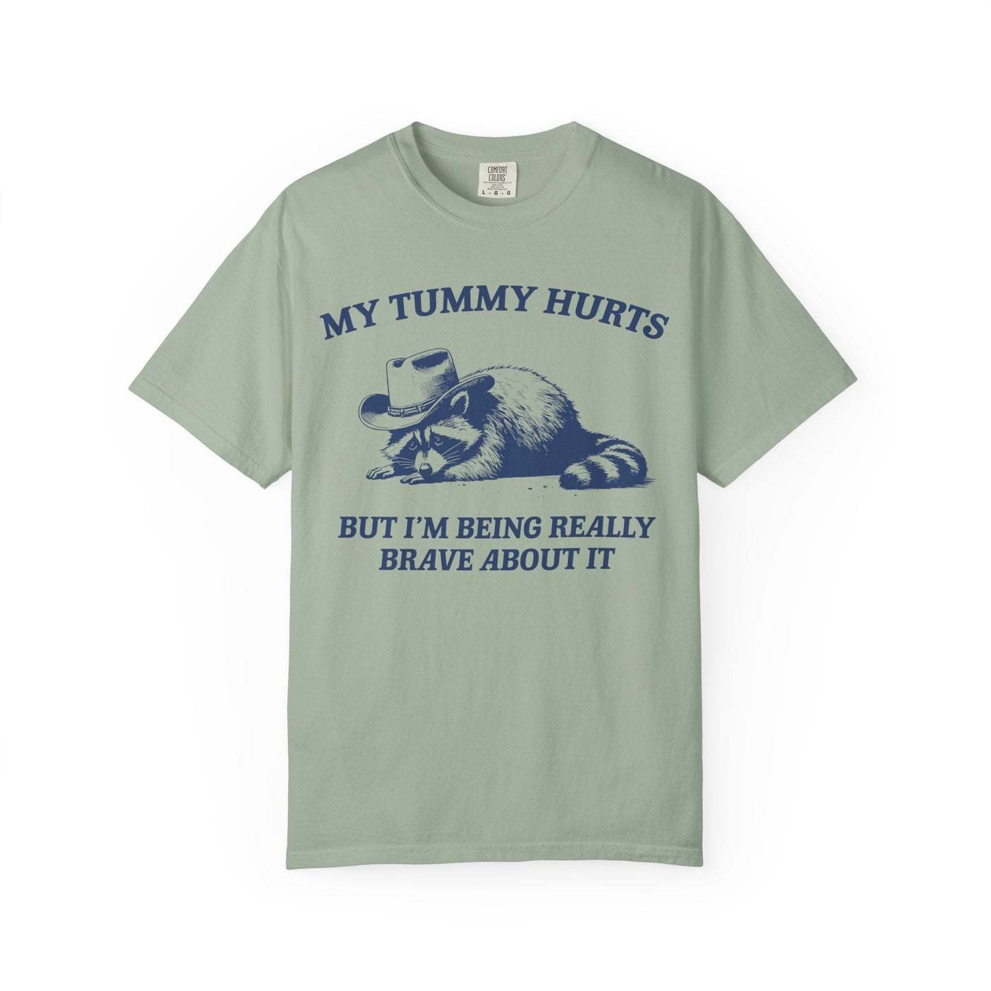 My Tummy Hurts But I’m Being Really Brave About It – Cowboy Raccoon Tee
