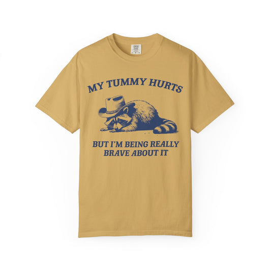 My Tummy Hurts But I’m Being Really Brave About It – Cowboy Raccoon Tee