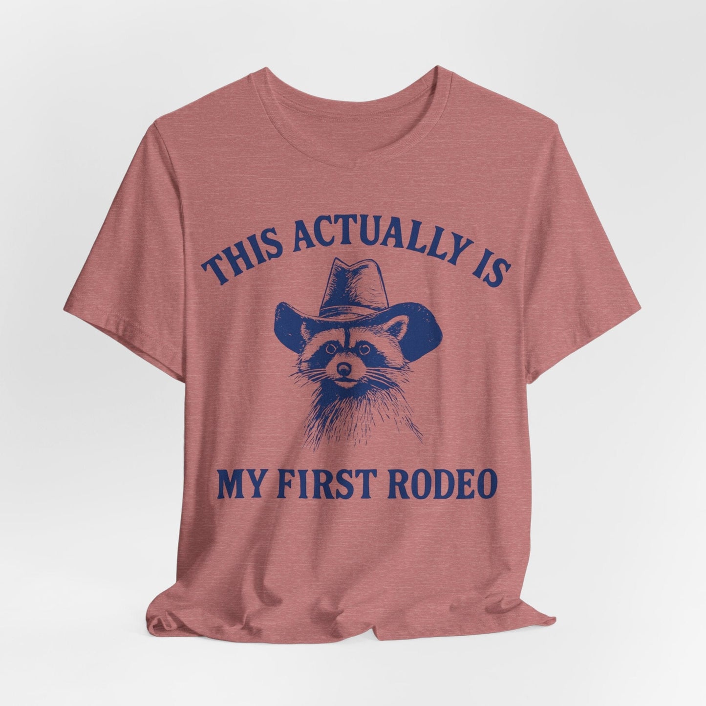 This Actually Is My First Rodeo – Cowboy Raccoon Tee