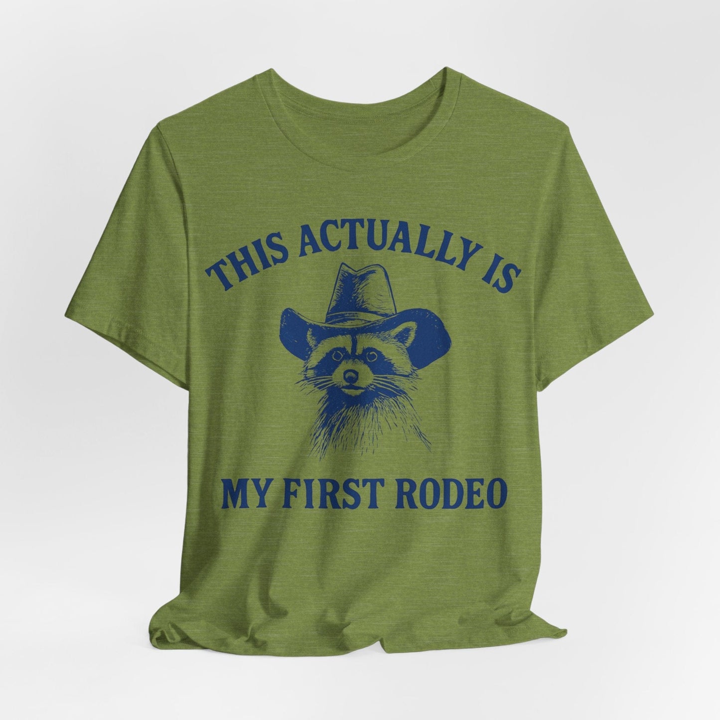 This Actually Is My First Rodeo – Cowboy Raccoon Tee