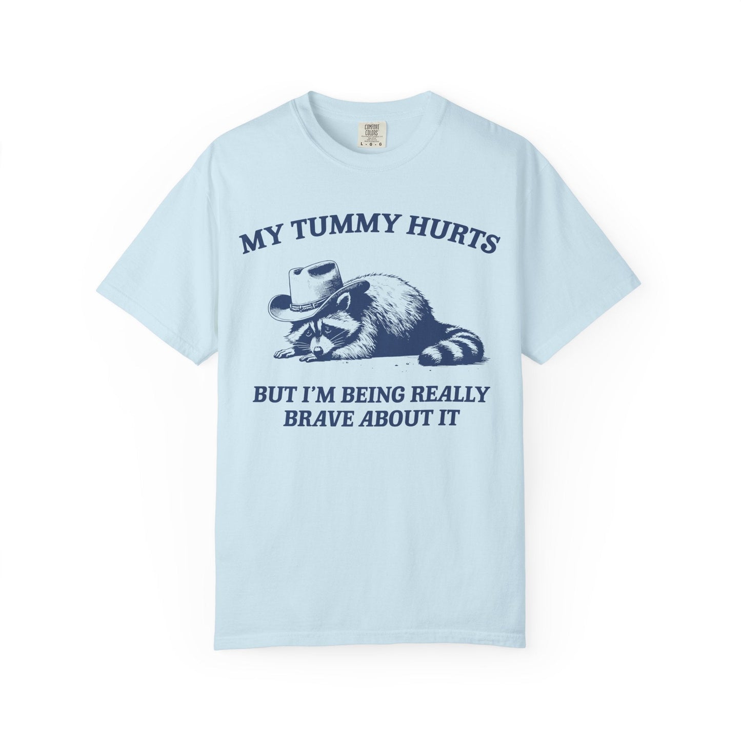 My Tummy Hurts But I’m Being Really Brave About It – Cowboy Raccoon Tee