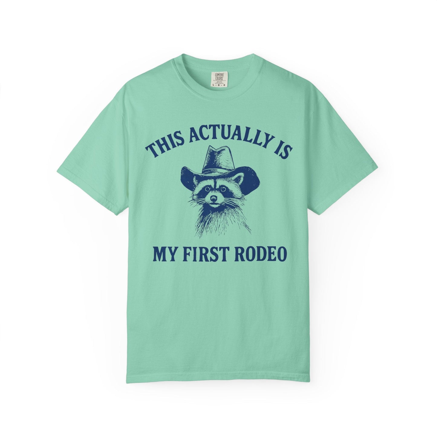This Actually Is My First Rodeo – Cowboy Raccoon Tee