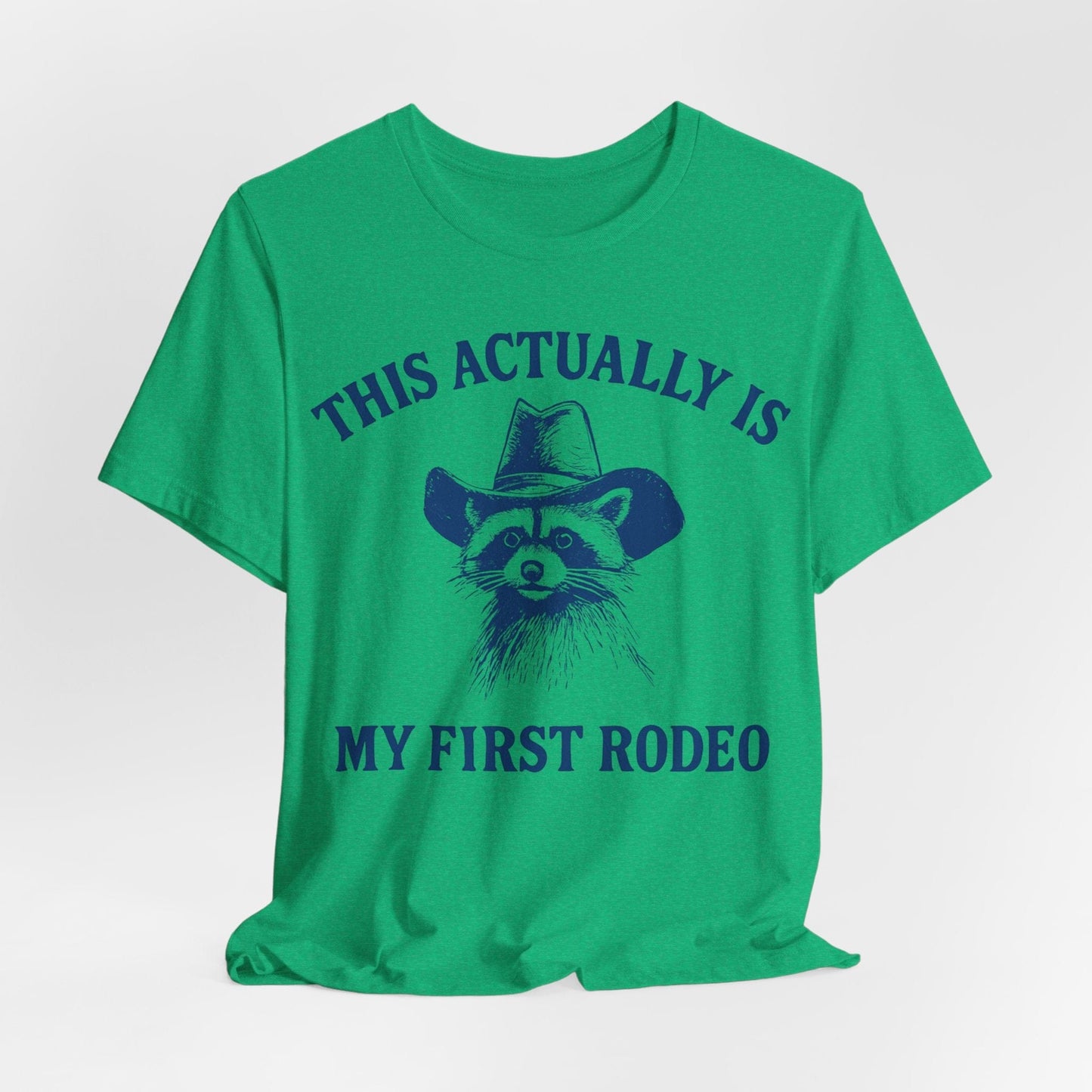 This Actually Is My First Rodeo – Cowboy Raccoon Tee