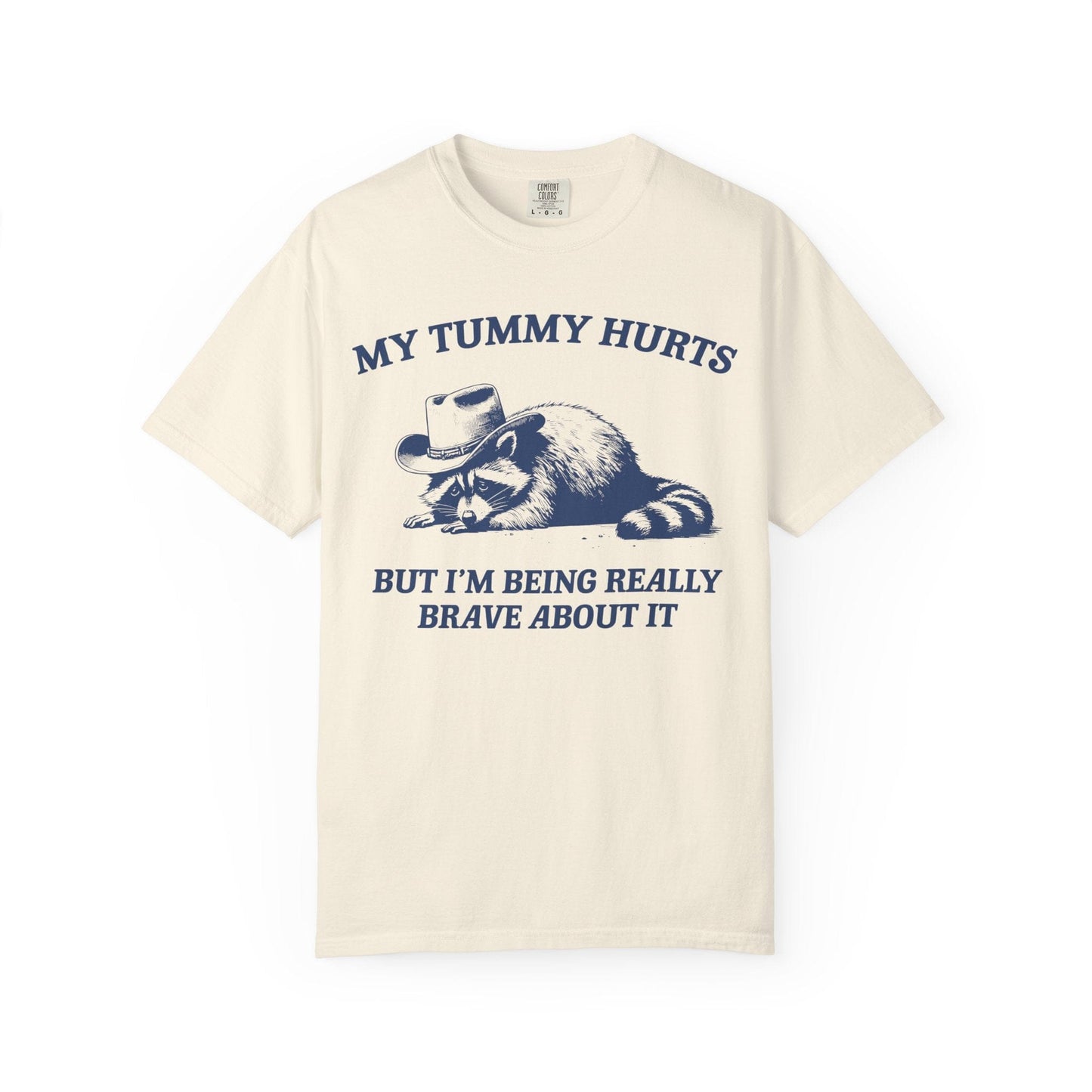 My Tummy Hurts But I’m Being Really Brave About It – Cowboy Raccoon Tee